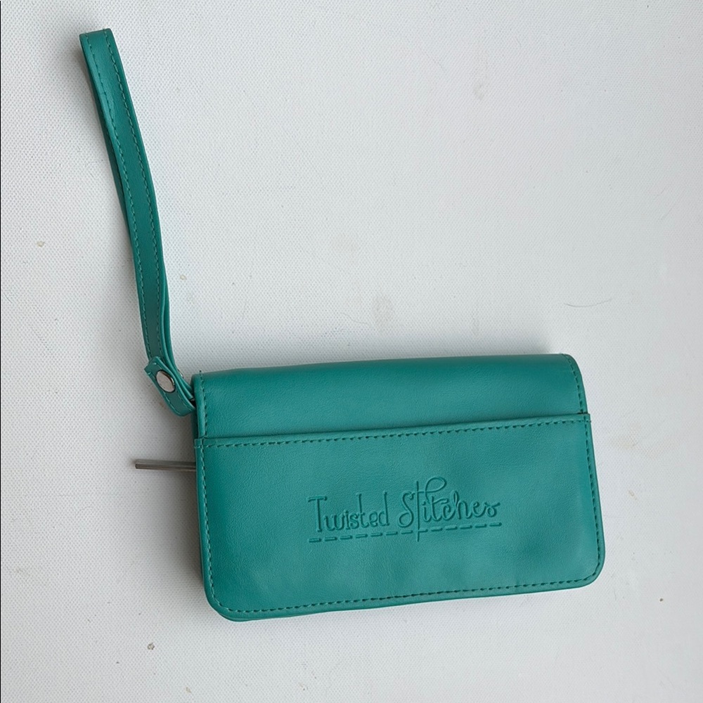 NWOT. Twisted Stitches Teal Wristlet